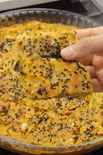 Homemade healthy no-dough leek borek with a golden cornmeal crust.