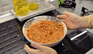 Boiling white cabbage leaves in a large pot until they are flexible.