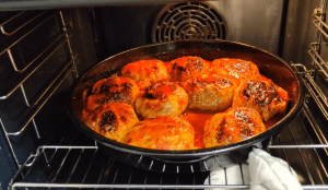 Covering the baking tray with a sheet of wet crumpled parchment paper.