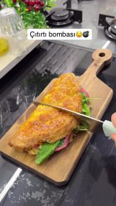 The final "Crunch Bomb" served on a plate, showing the crispy texture and melted cheese inside.