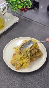 The final creamy curry potato salad mixed thoroughly and transferred to a serving platter, garnished with dill.