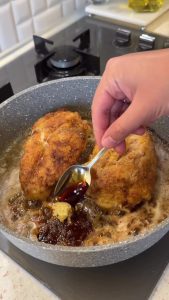Drizzling honey and soy sauce over the chicken fillets to create a thick and sticky glaze.