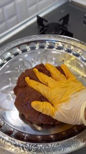 Checking the "cotton-soft" and perfectly smooth texture of the çiğ köfte after kneading.