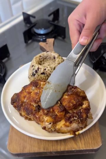 A close-up of golden brown chicken breast fillets coated in a glossy honey garlic soy sauce.