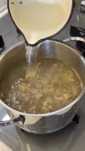 Adding a tablespoon of butter and two tablespoons of flour to the sautéed mushrooms.