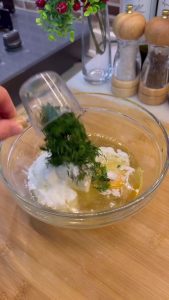 Adding a large handful of finely chopped fresh dill to the liquid pastry ingredients.