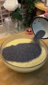 Adding blue poppy seeds and semolina to the cake batter for texture.