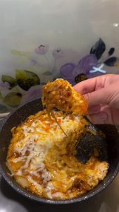 The final dish of cheesy Turkish caramelized onion and eggs ready for serving.