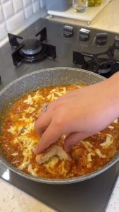 The final dish with melted, bubbly cheese over the eggplant and tomato medley.