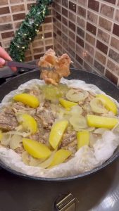 Flipping the tender chicken butterfly pieces to sear the skins in the pan.