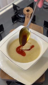 Melting butter with red pepper flakes in a small pan for the final soup garnish