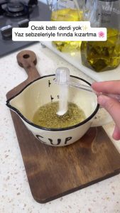 Mixing oil, minced garlic, and paprika in a small bowl for the vegetable dressing.