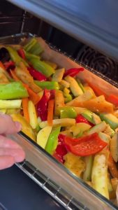Baking the vegetable medley in a 200 degree oven until golden brown.