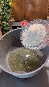 Sautéing flour and vegetable oil in a pot to create a soup roux.
