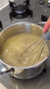 Stirring flour and mushrooms together until the flour is fragrant and cooked through.