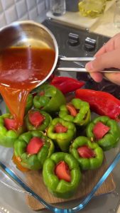 Sautéing red pepper paste with vegetable oil in a small pan to prepare the cooking sauce.