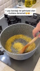 Sautéing thin vermicelli pasta in melted butter until golden in a deep pot.