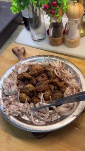 Final presentation of crispy chicken livers with a side of traditional Turkish sumac onions.