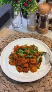 The final dish: Fellah köftesi in tomato sauce served over a bed of garlic yogurt