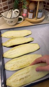 Slicing long eggplants into thin strips for the beyti wrap.