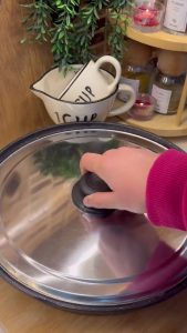 Cooking the chicken on a stovetop over very low heat with the pan lid closed.