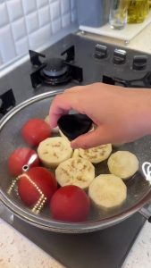 Covering the skillet with a lid to steam the vegetables on low heat.