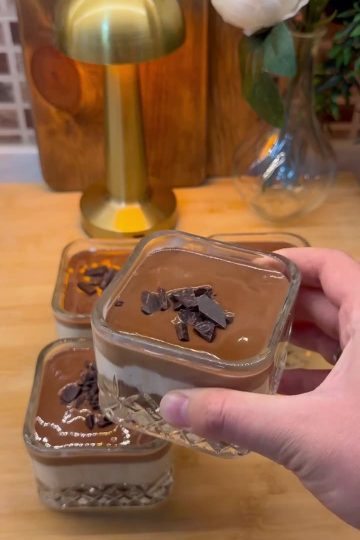 Creamy layered Turkish milk pudding cups with crumbled cake base and glossy chocolate ganache topping.