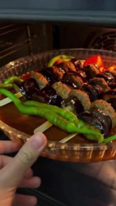 Baking the eggplant and meatball kebab skewers in a 200 degree oven.