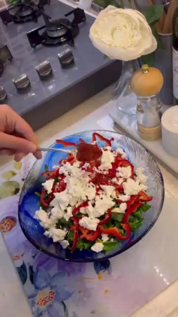 Preparing a fresh spinach and feta filling for gözleme.