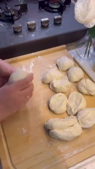 Rolling out dough thin for Turkish spinach flatbread.