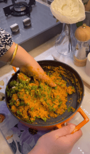 Adding fresh parsley and green onions to lentil balls.