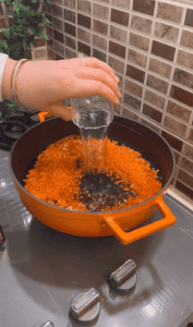Boiling red lentils in a pot for Turkish köfte.