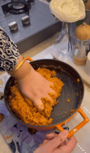 Kneading the red lentil and bulgur dough by hand.