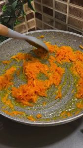 Letting sautéed carrots cool down in a small bowl.