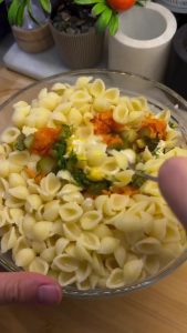 Adding all ingredients into the yogurt dressing bowl.