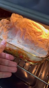 Roasting the vegetable and chickpea dish in the oven.