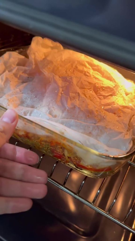 Roasting the vegetable and chickpea dish in the oven.