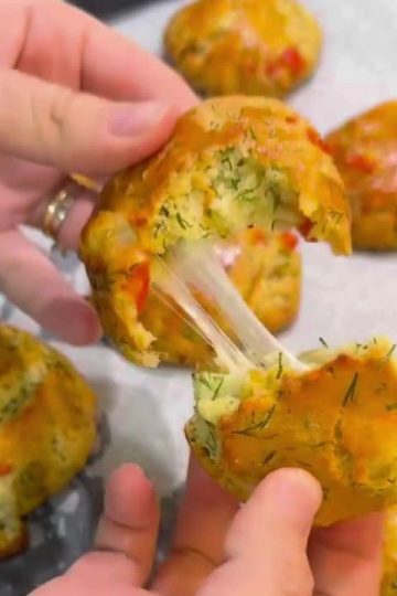 A tray of golden yeast-free Turkish pastries stuffed with cheese and fresh vegetables.