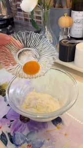 Whisking yogurt and egg yolk for a Turkish soup tempering.
