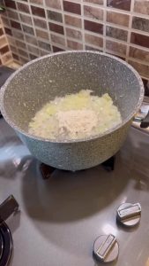 Sautéing onions and flour in a soup pot for Ottoman soup.