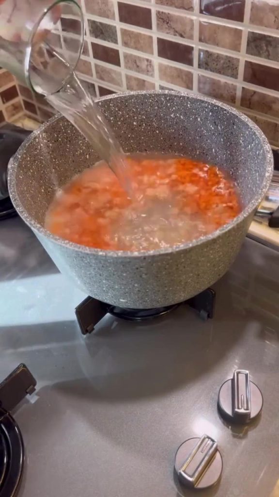 Simmering red lentils in a large pot for Çeşmi Nigar.