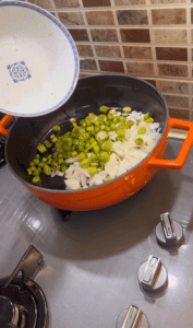 Sautéing onions and green peppers for a Turkish sauce base.