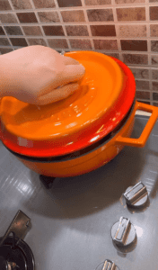 Slow-simmering a Turkish eggplant stew on a low stovetop.