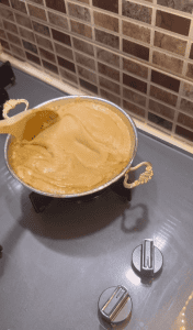 Melting cheese into a cornmeal and butter base for a stretchy texture.