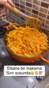 Boiling pasta in a pot and scooping out starchy water.