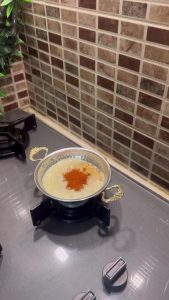 Melting butter with red pepper flakes in a small saucepan.