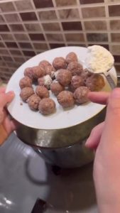 Kneading ground beef and spices for Turkish meatballs.